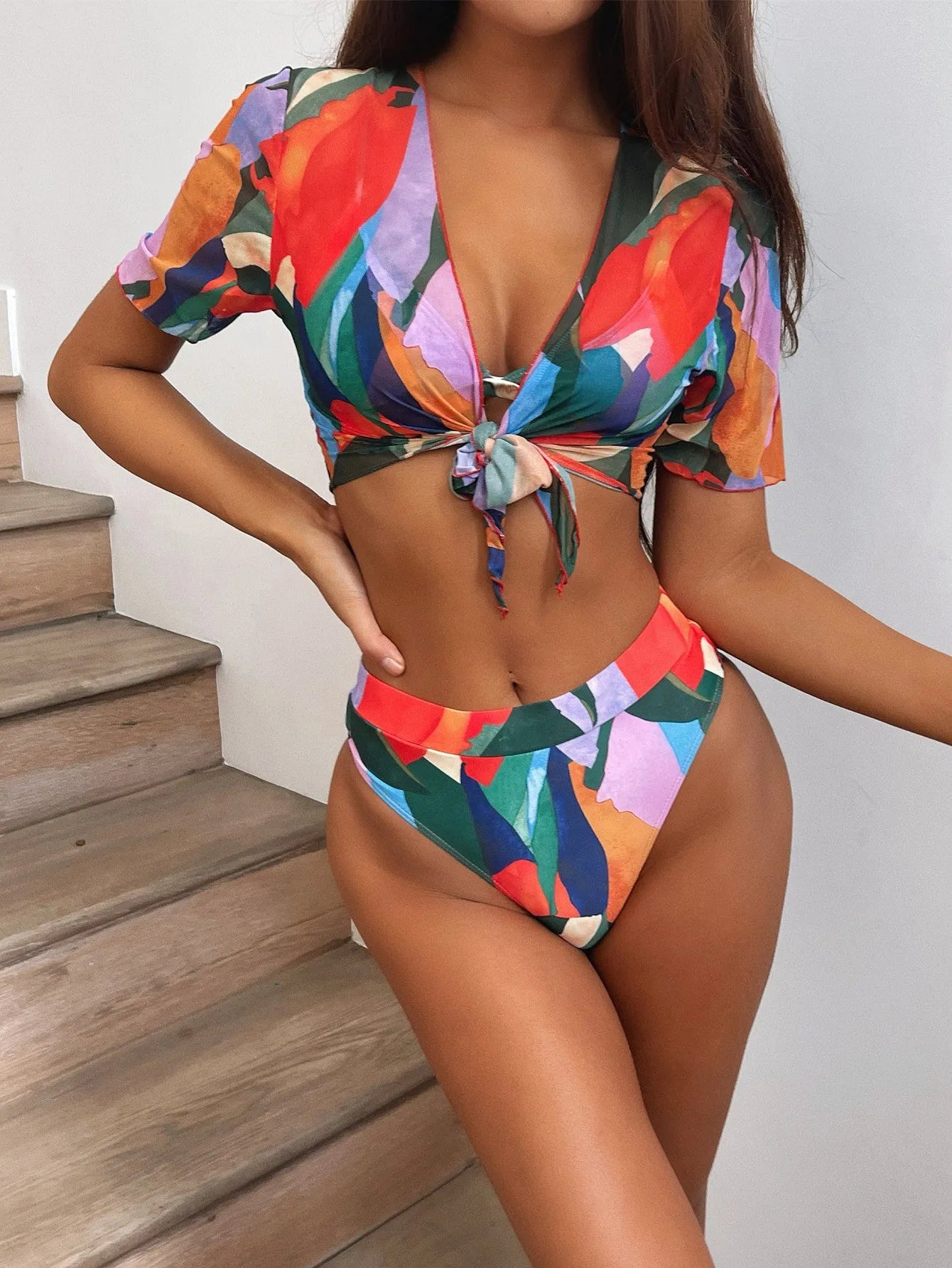 Red women's printed split swimsuit with briefs and bikini styling for swimming