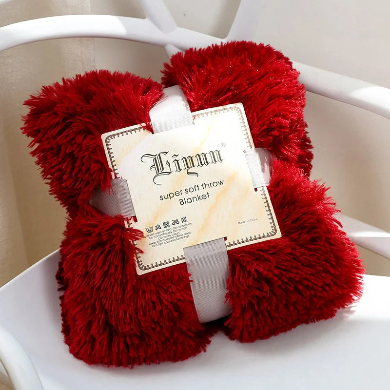 Soft coral fleece blanket in various colours and sizes for home and travel comfort