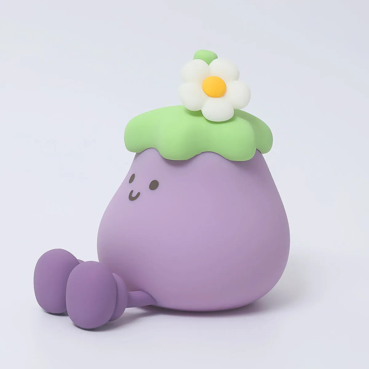 Cartoon eggplant-shaped night light with soft yellow glow measuring 100mm diameter