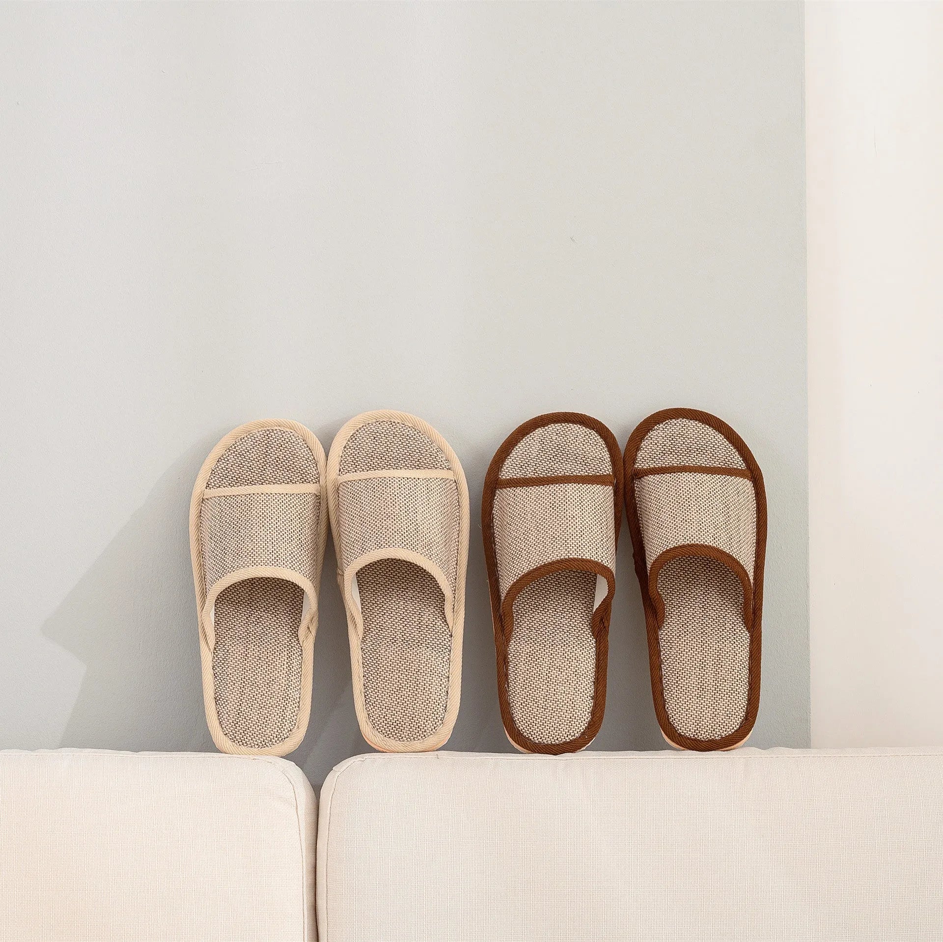 Women's open-toe linen slippers with thick sole in light brown colour.