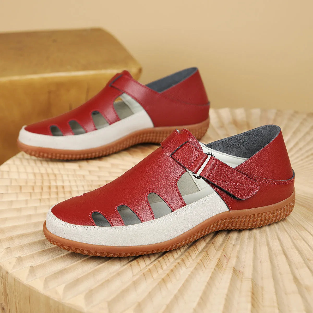 Plus size women's flat sandals with toe cap, hollow design, and thick rubber sole in blue.