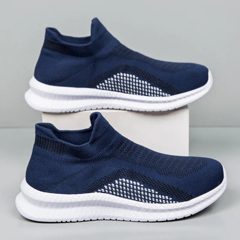Low-top casual sneaker in Popcorn Flyknit fabric, showing flat heel and round toe design.