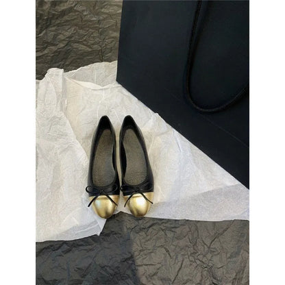 Apricot flat ballet shoes with a bowknot, round toe, and soft rubber sole.