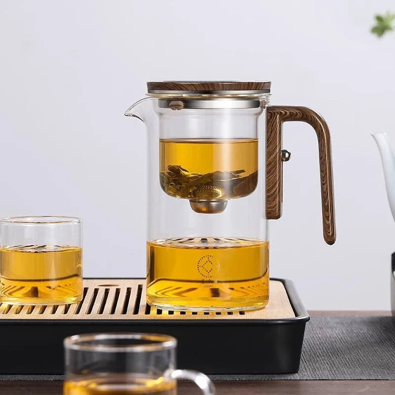 Elegant glass teapot with magnetic water separation filter and wooden handle for brewing and pouring loose leaf tea