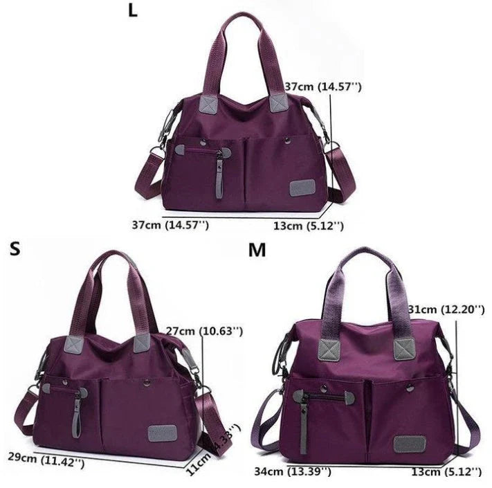 A fashionable and versatile ladies tote bag with multiple compartments and carrying options for the modern woman on the move.