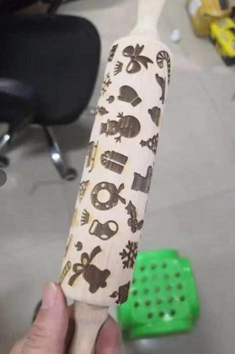 Festive rolling pin with embossed Christmas designs for easy imprinting on dough