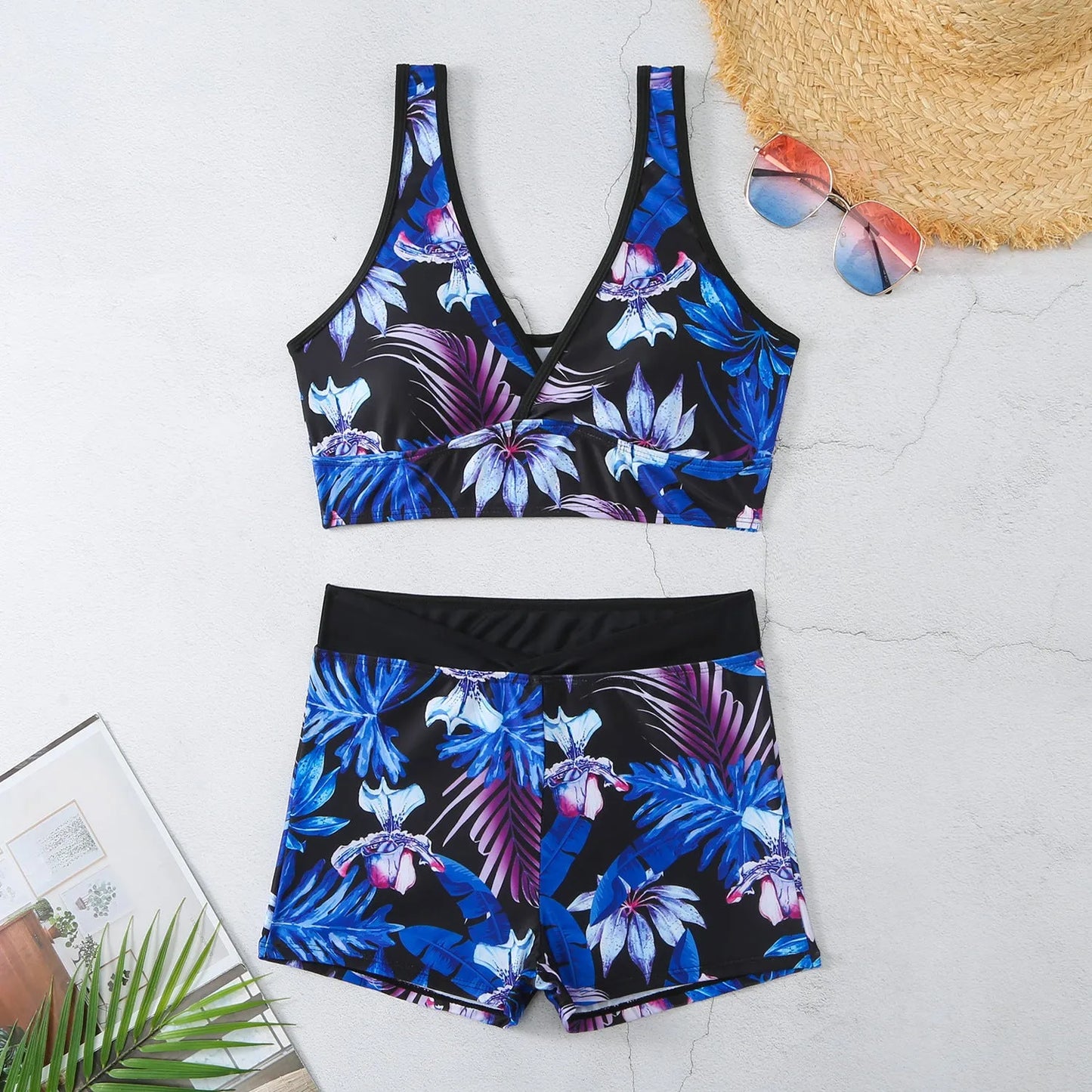 Women's two-piece swimsuit set showing sleeveless bikini top and printed boxer-style briefs in a multi-colour pattern.