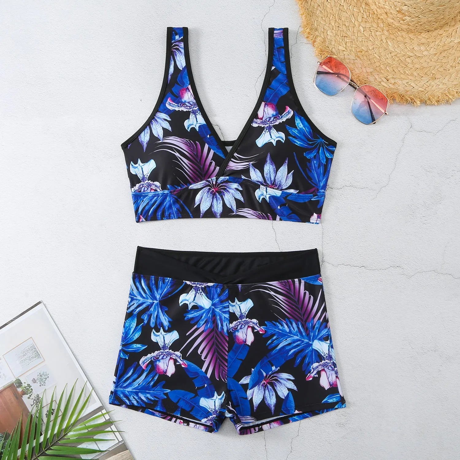 Women's two-piece swimsuit set showing sleeveless bikini top and printed boxer-style briefs in a multi-colour pattern.