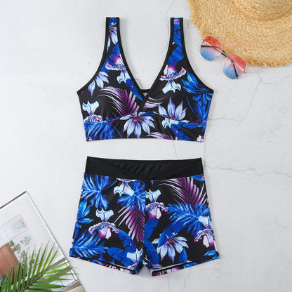 Women's two-piece swimsuit set showing sleeveless bikini top and printed boxer-style briefs in a multi-colour pattern.