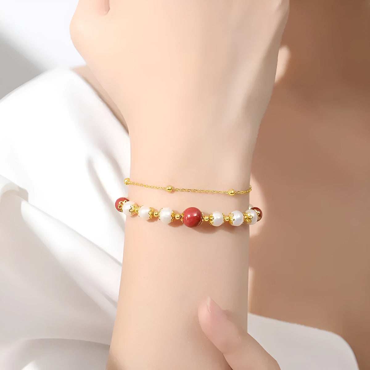 Double-layer women's bracelet with freshwater pearls and geometric cinnabar beans on sterling silver
