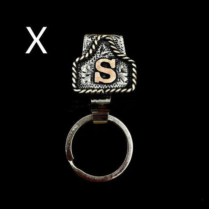 Handmade cow tag design metal keychain on a keyring, shown in one of many available colours.