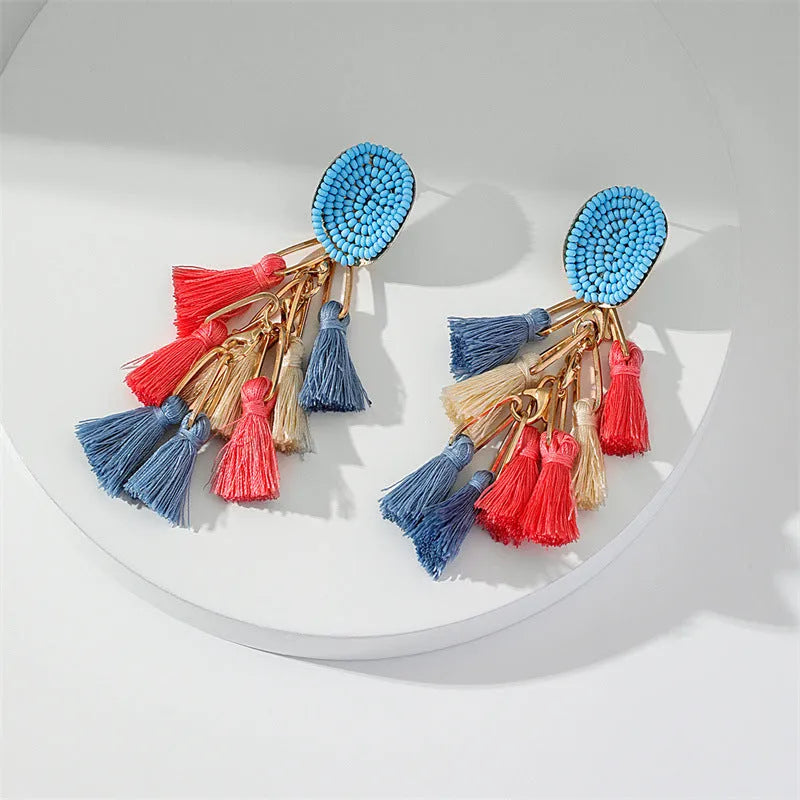 Handmade bohemian shell tassel earrings for women with colourful flower and geometric drop design