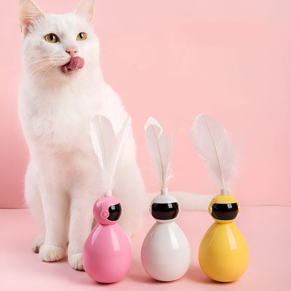 Tumbler cat toy in white, yellow, or pink with ABS body and feather replacement pieces.