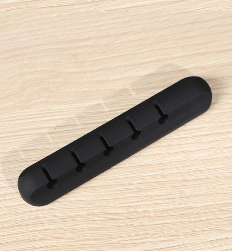 Black silicone USB cable winder for desktop cable management