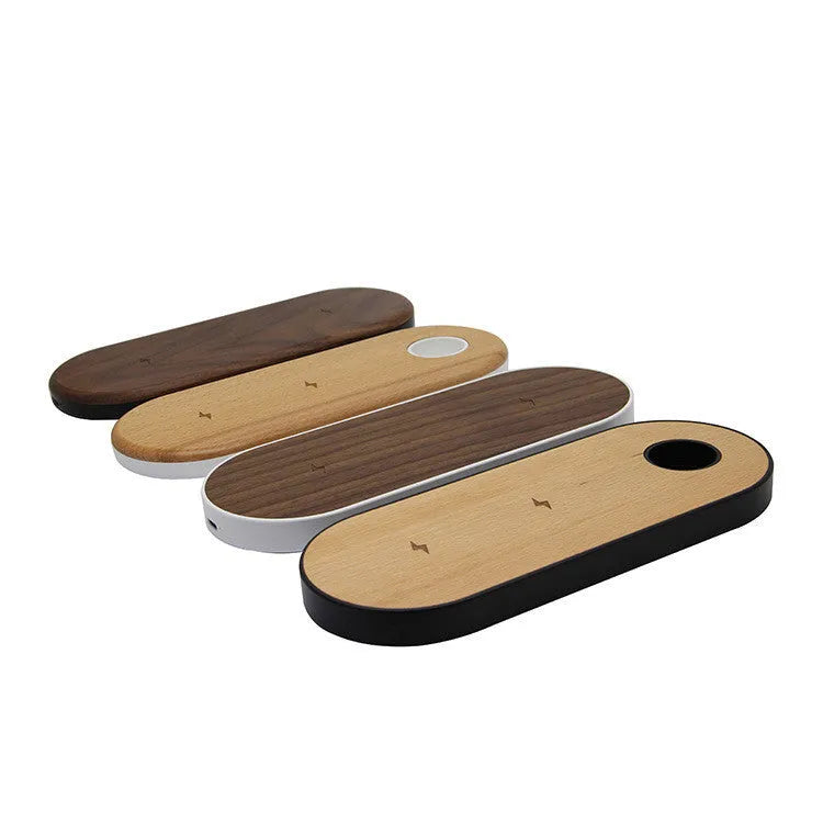 Ultra-thin bamboo and wood wireless charging stand for smartphones on a desk.