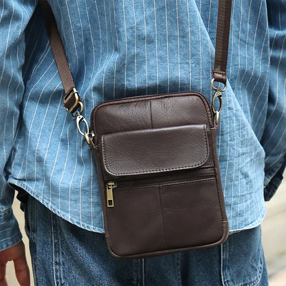 Men's brown genuine leather crossbody shoulder bag with visible stitching.