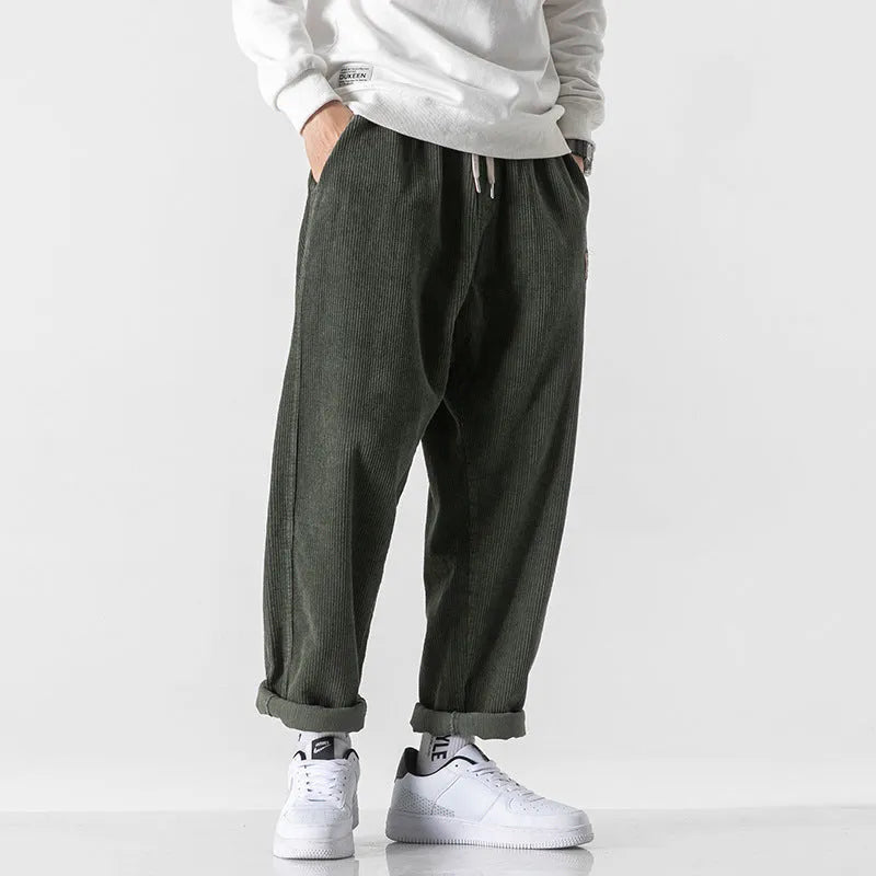 Men's loose fit corduroy sports trousers in Army Green colour with straight leg design and elasticated waist