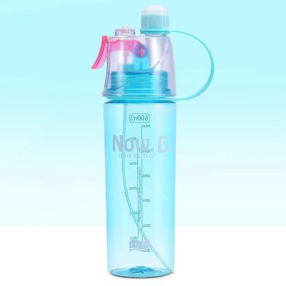 Green mist spray sports water bottle with handle, scale, and press-top lid on a gym bench.