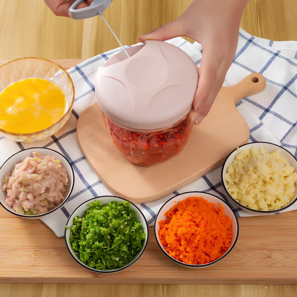 Manual garlic cutter with stainless steel blades in blue, green, or pink colours with transparent collection container