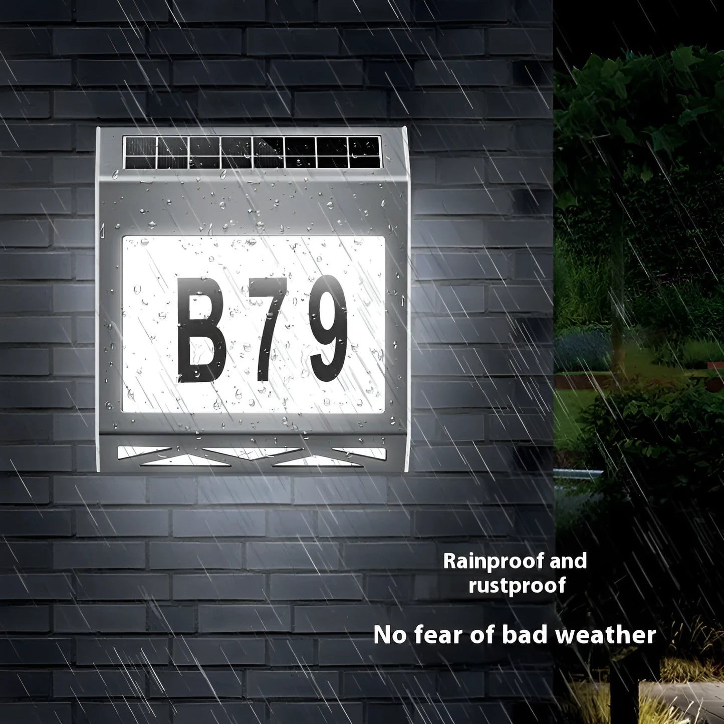 Black solar doorplate light with LED illumination showing house numbers