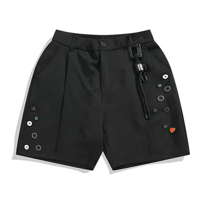 A pair of black loose-fit semi-elastic shorts with a colour button and zipper fly.