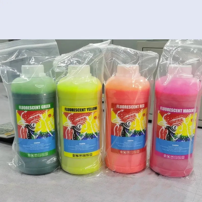 Fluorescent sublimation ink for PET film and offset hot paint applications in 500ml and 1000ml capacities, available in fluorescent red, yellow, orange, and green colours for specialised printing projects.