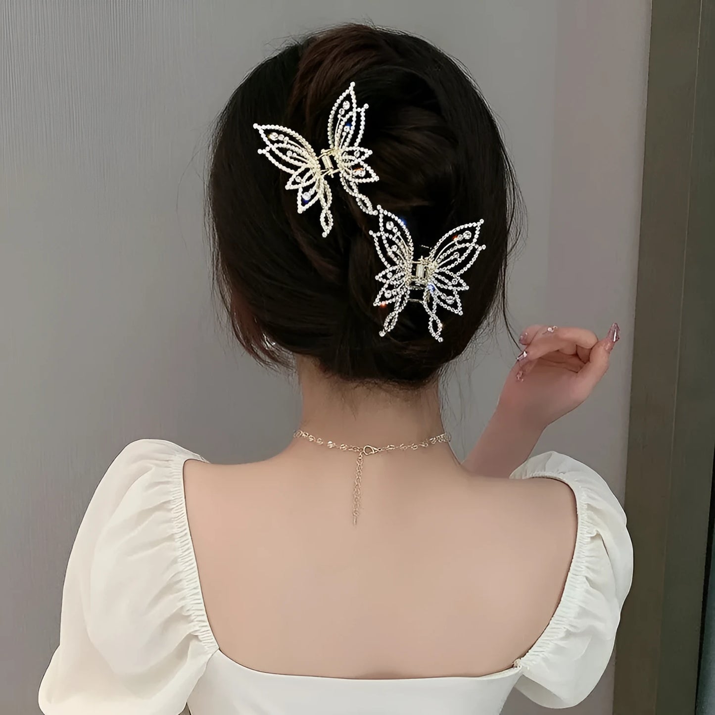 Butterfly hair clip for women with alloy construction and rhinestone or pearl decoration