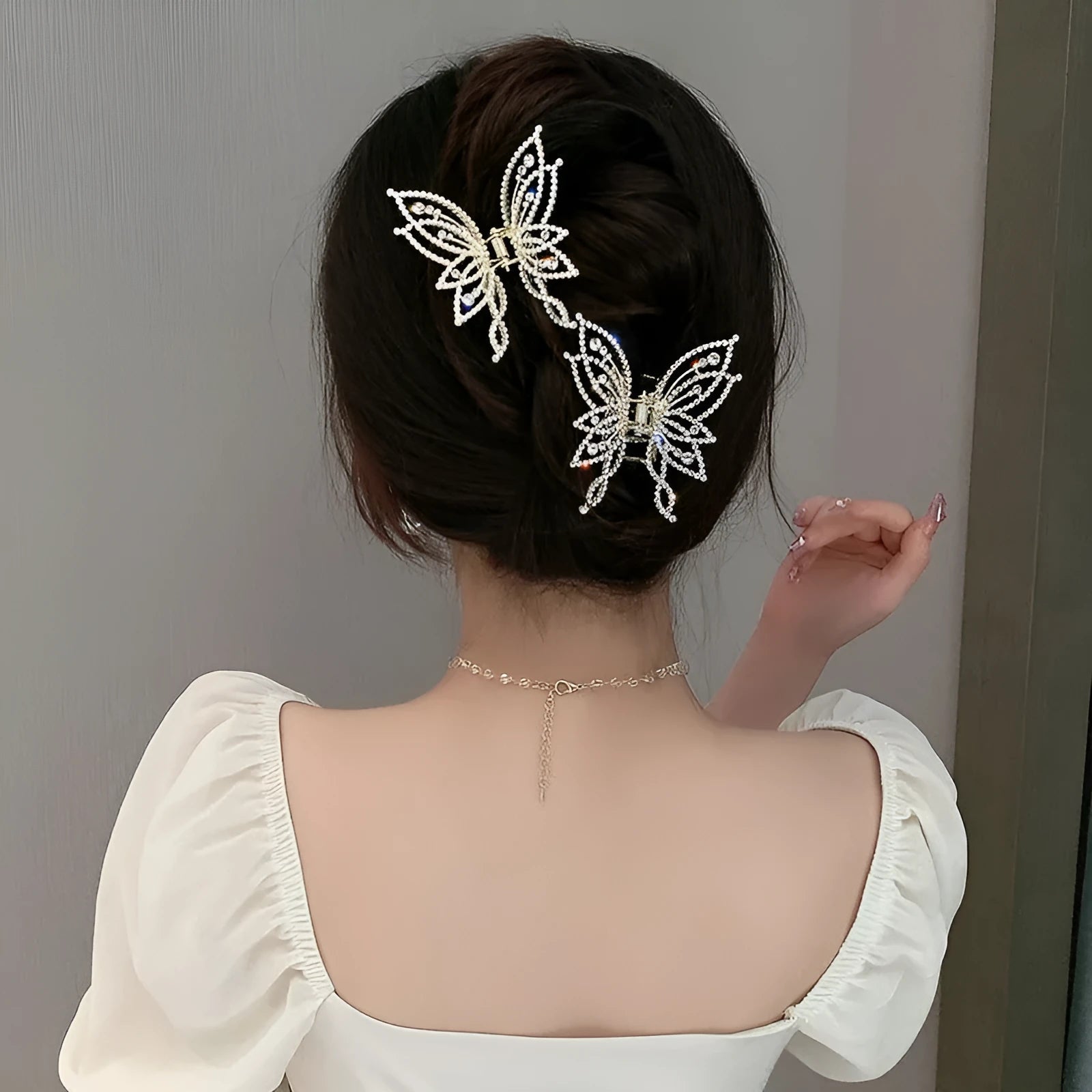 Butterfly hair clip for women with alloy construction and rhinestone or pearl decoration