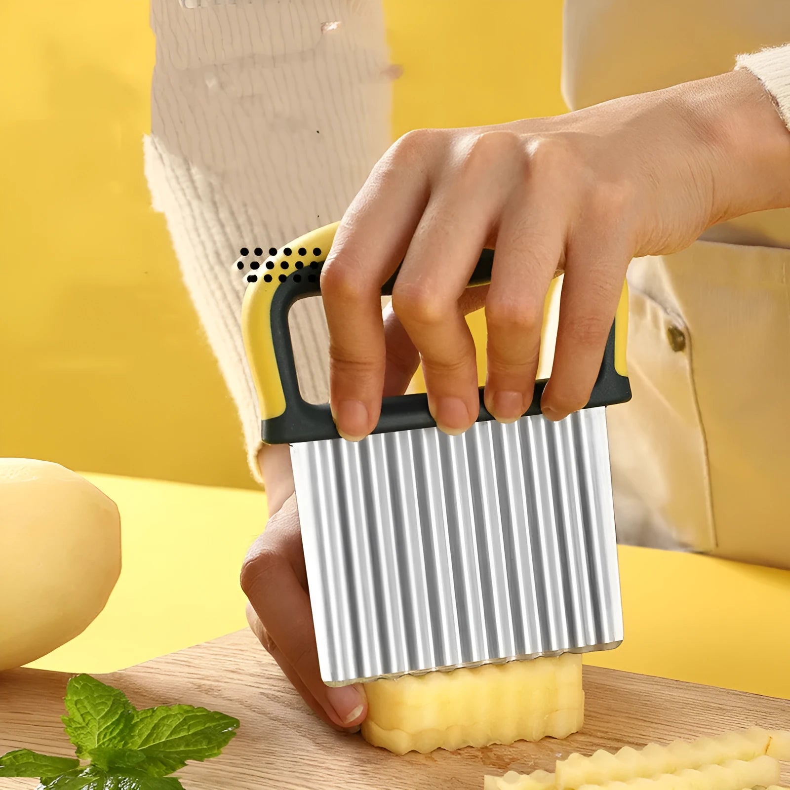 Stainless steel potato dicing tool with wolf tooth knife edge on yellow packaging