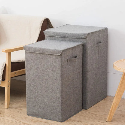 Foldable cube-shaped laundry basket in cotton linen fabric, shown in brown colour.
