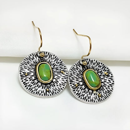 A pair of retro-style earrings with turquoise colour separation and an antique silver electroplated finish.