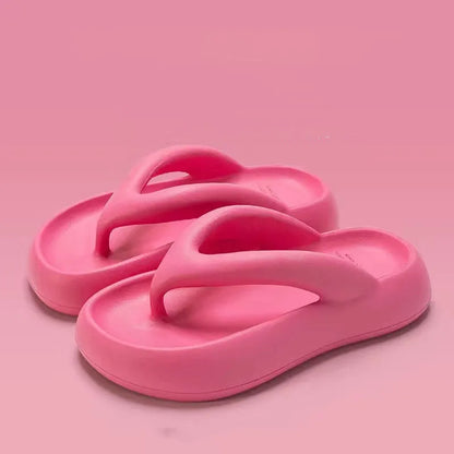Solid colour thick-soled flip-flops with a bow on the strap, shown in multiple colour options.