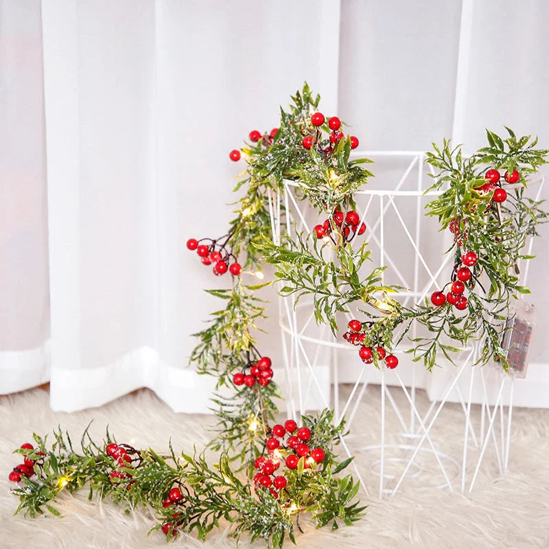 Festive Christmas fairy lights with leaf shapes and crimson berries, creating a warm, enchanting glow