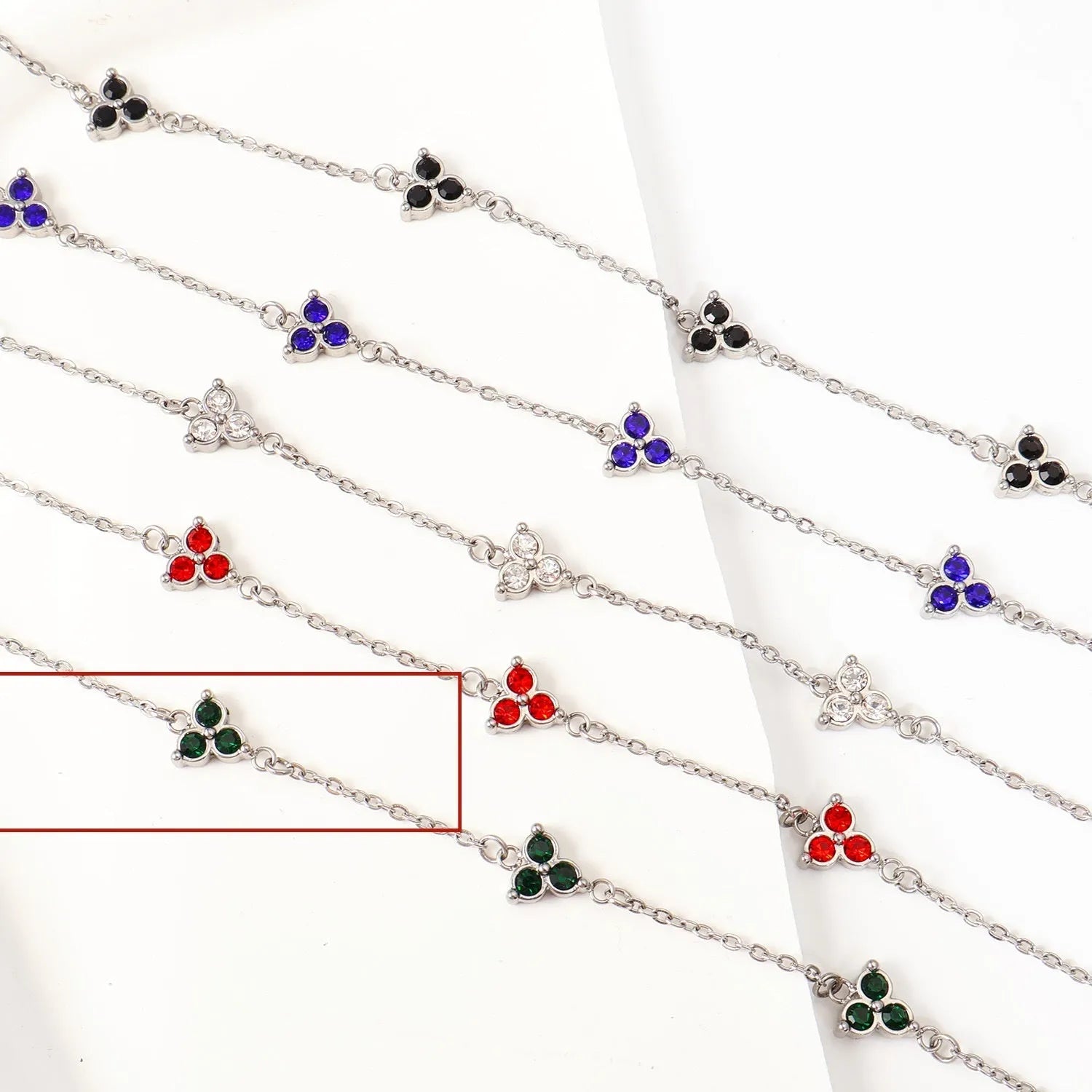 Women's stainless steel three diamond geometric triangular bracelet in gold finish with white zircon gemstones
