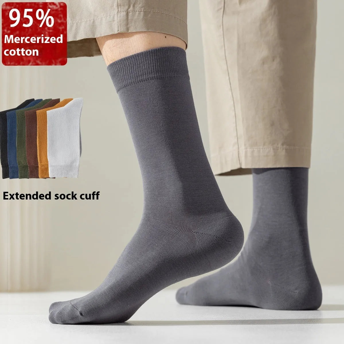 Pair of solid-colour men's mid-calf socks made from combed cotton on a wooden background