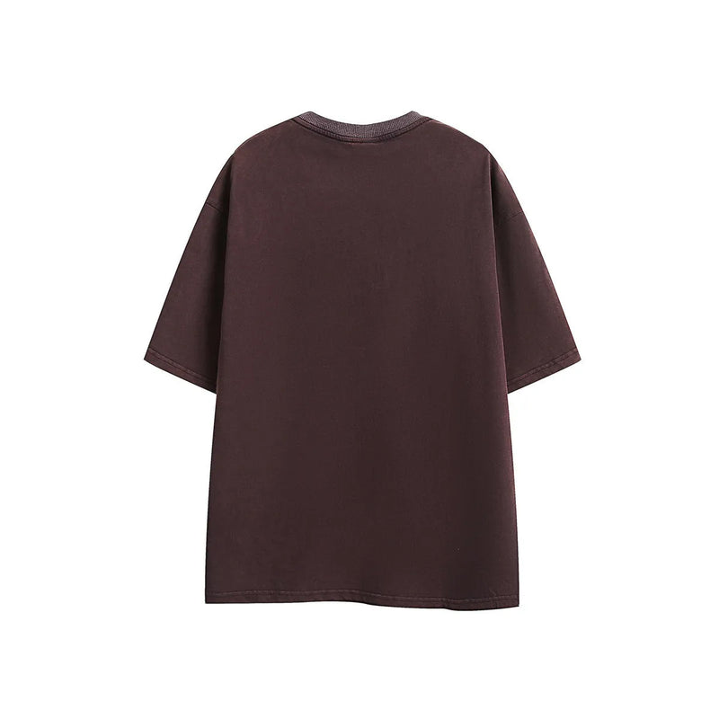 Short-sleeved embroidered t-shirt in washed cotton, loose-fitting retro style with half-sleeves and pullover design, available in sizes M to 2XL and colours black or purple, suitable for leisure wear.
