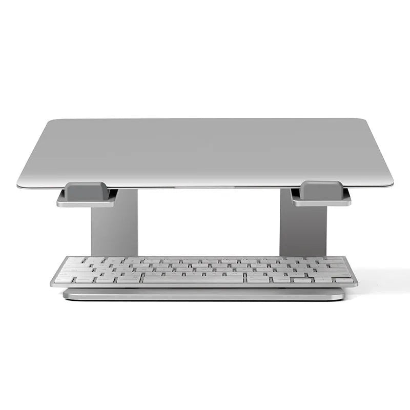 Black aluminium alloy laptop stand on a desk, showing its raised platform and open base design.