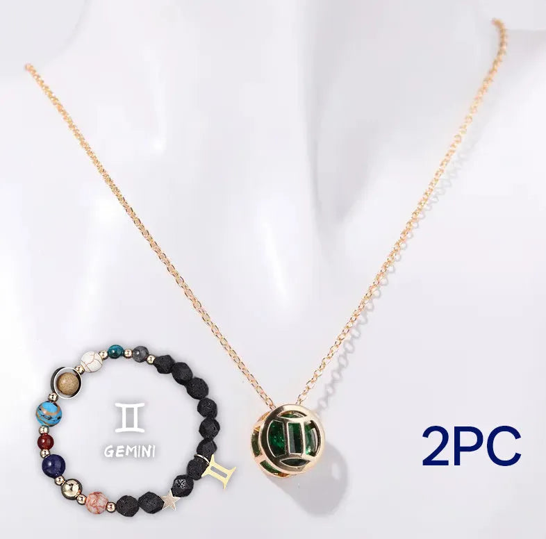 A natural stone beaded necklace and matching bracelet set laid flat, showcasing varied bead colours and textures.