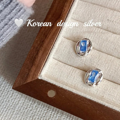 Women's S925 sterling silver oval blue diamond heart-wrapped earrings with electroplated silver finish