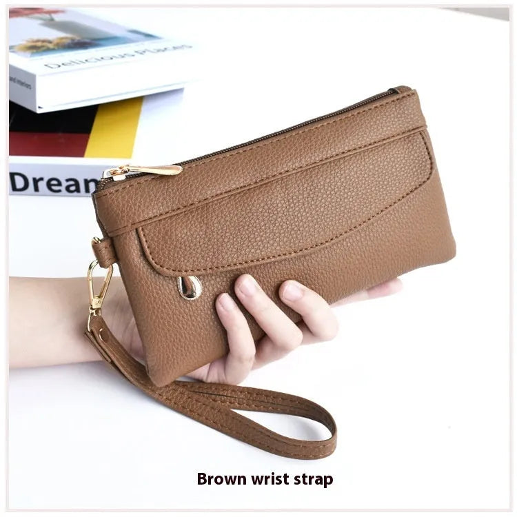 Soft surface square PU crossbody bag and clutch with internal zipper pocket in various colours.