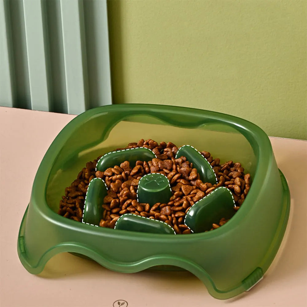 Blue plastic anti-choke slow feeder bowl for dogs on a floor