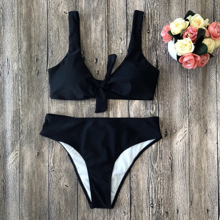 Solid colour bikini set with adjustable side-tie straps and cheeky briefs on a neutral background.