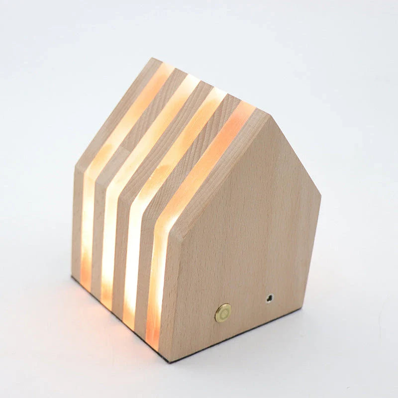 A warm, Scandinavian-inspired wooden LED night light in the shape of a heart or small house, providing cozy illumination for any room
