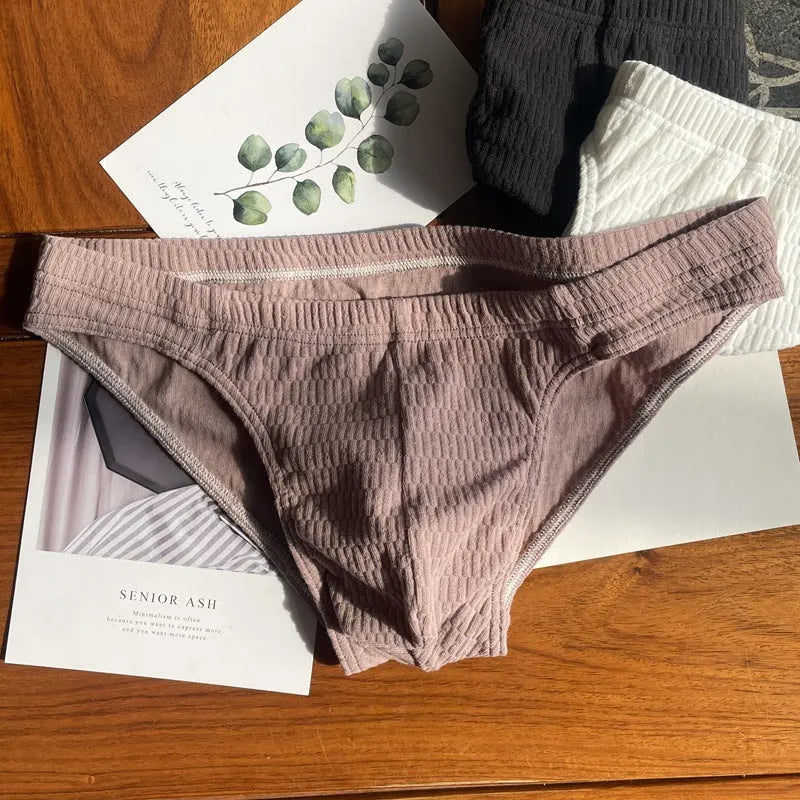 Men's solid colour pure cotton triangle underwear briefs on a mid-waist fit model