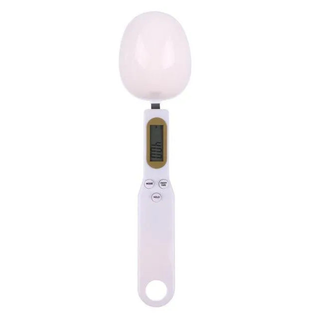 White digital spoon kitchen scale with LCD display showing weight measurement