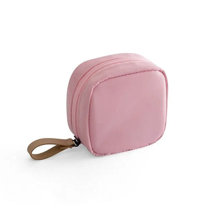 Cube-shaped cloth makeup storage bag in blue, pink, white, or white pink plain pattern for cosmetic organisation
