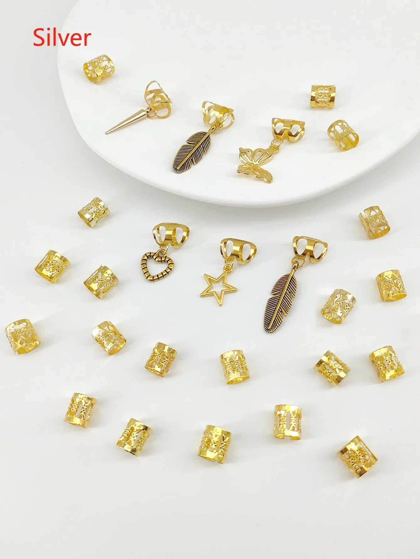 Pack of 26 antique-style dirty braid hair rings in alloy metal with gold electroplated finish.