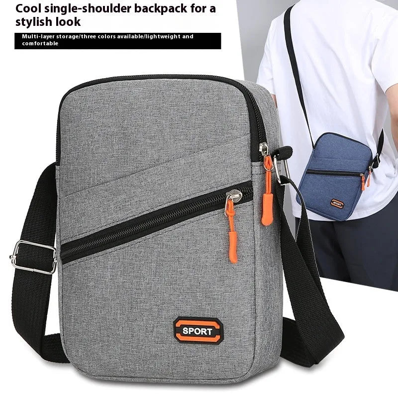 Ultra-light Oxford cloth commuter crossbody bag in solid colour with contrast stitching.