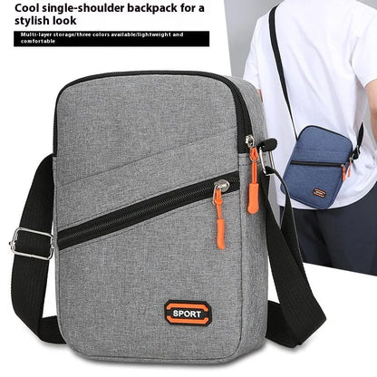 Ultra-light Oxford cloth commuter crossbody bag in solid colour with contrast stitching.