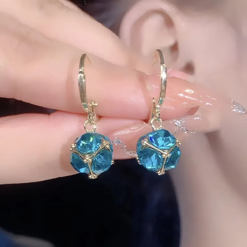 Geometric copper women's earrings with zircon accents and rose design elements in multiple colour variations